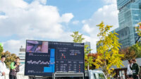 古野電気が階段マラソンで技術協力、アスリートのバイタルデータをリアルタイム公開