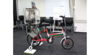芝浦工業大、ジャイロ制御による低速時の自転車転倒防止システムを開発