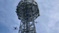 沖縄セルラーとKDDIスマートドローン、ドローンを用いた通信基地局の自動点検を実証